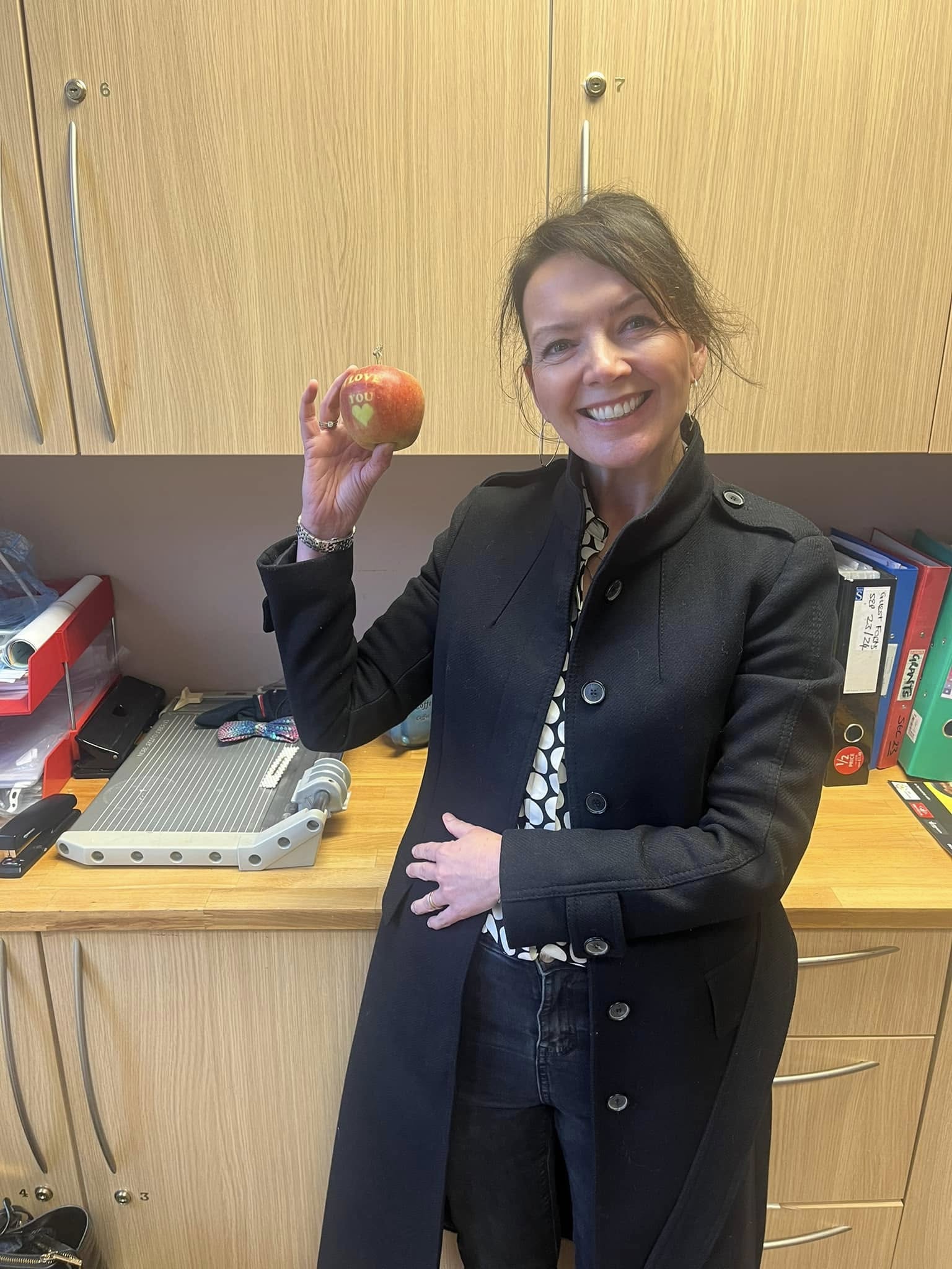 Woman holding an apple